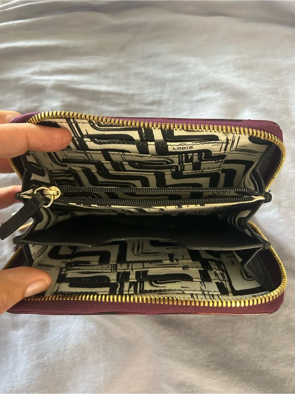 Hard to find patterned Patent Purple Wristlet Wallet with Gold Tone Hardware.